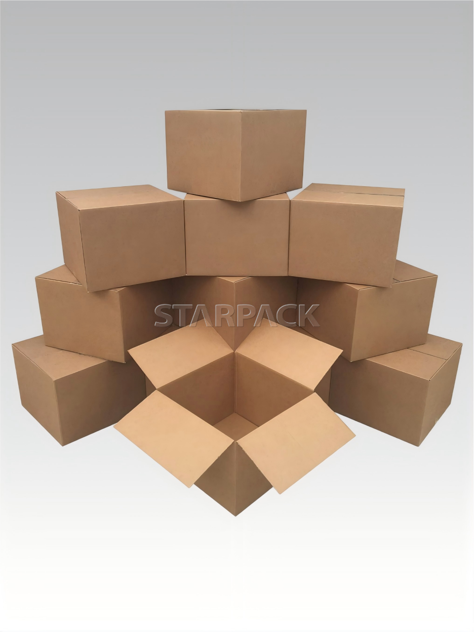 Stacked empty corrugated cardboard moving boxes in various sizes for storage and delivery