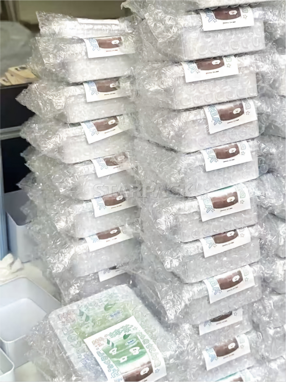 Clear bubble mailers used as protective packaging for goods shipping application scene